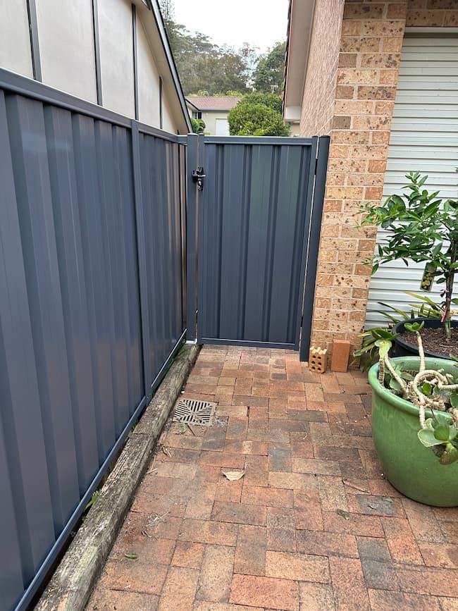 Port Macquarie Ironstone Colorbond fence — Mid Coast Boundary Fencing, NSW